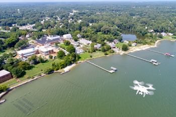 VIMS professor Donglai Gong flies his aerial drone near the VIMS campus in search of algal blooms in the York River. © D. Gong/VIMS.