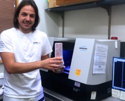 Diego Vaz prepares to run a CT scan in the lab at Friday Harbor.