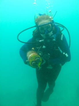 Dr. Emily Rivest retrieves a pH sensor full of data from a reef in Taiwan. © Apple Chui.