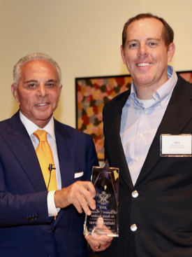 Joe Plumeri presents a Plumeri Award for Faculty Excellence to VIMS Professor Matthew Kirwan. © S. Salpukas.