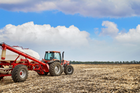 A farmer applies nitrogen fertilizer to a field.