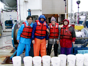 Scientists with the VERTIGO project studied plankton from the ocean's twilight zone. From L: Toru Kobari (Kagoshima University, Japan), marine technician Joe Cope, graduate student Stephanie Wilson, and Dr. Deborah Steinberg with numbered sample buckets.