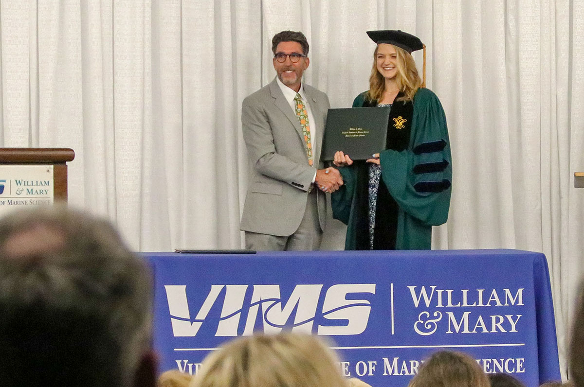 Alex Schneider celebrates graduation at the W&amp;M School of Marine Science Diploma Ceremony. Photo by John Wallace.